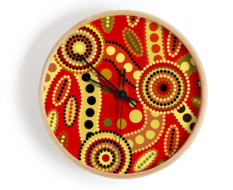 Aboriginal Red Tribal clock made from natural bamboo with a vibrant tribal design and clear Plexiglas lens.